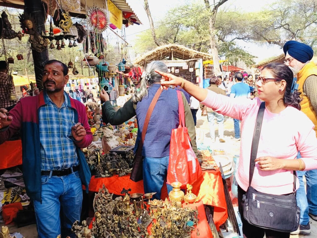 Uttar Pradesh's brass craftsmanship attracts tourists' attention at the Surajkund International Crafts Fair